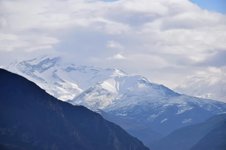 a mountain range and a stream with water