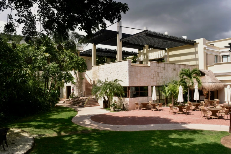 the patio is made with cement and grass