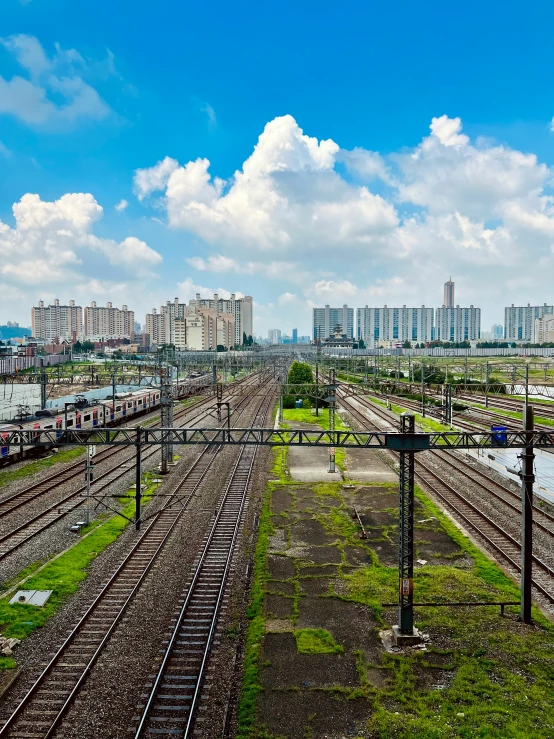 a train yard and its tracks surrounded by tall buildings