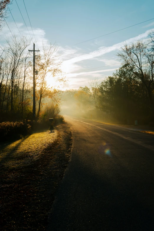 an empty street is seen near power lines