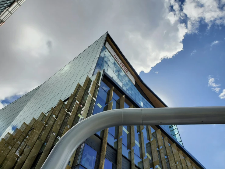 the outside of a tall building, seen through the glass