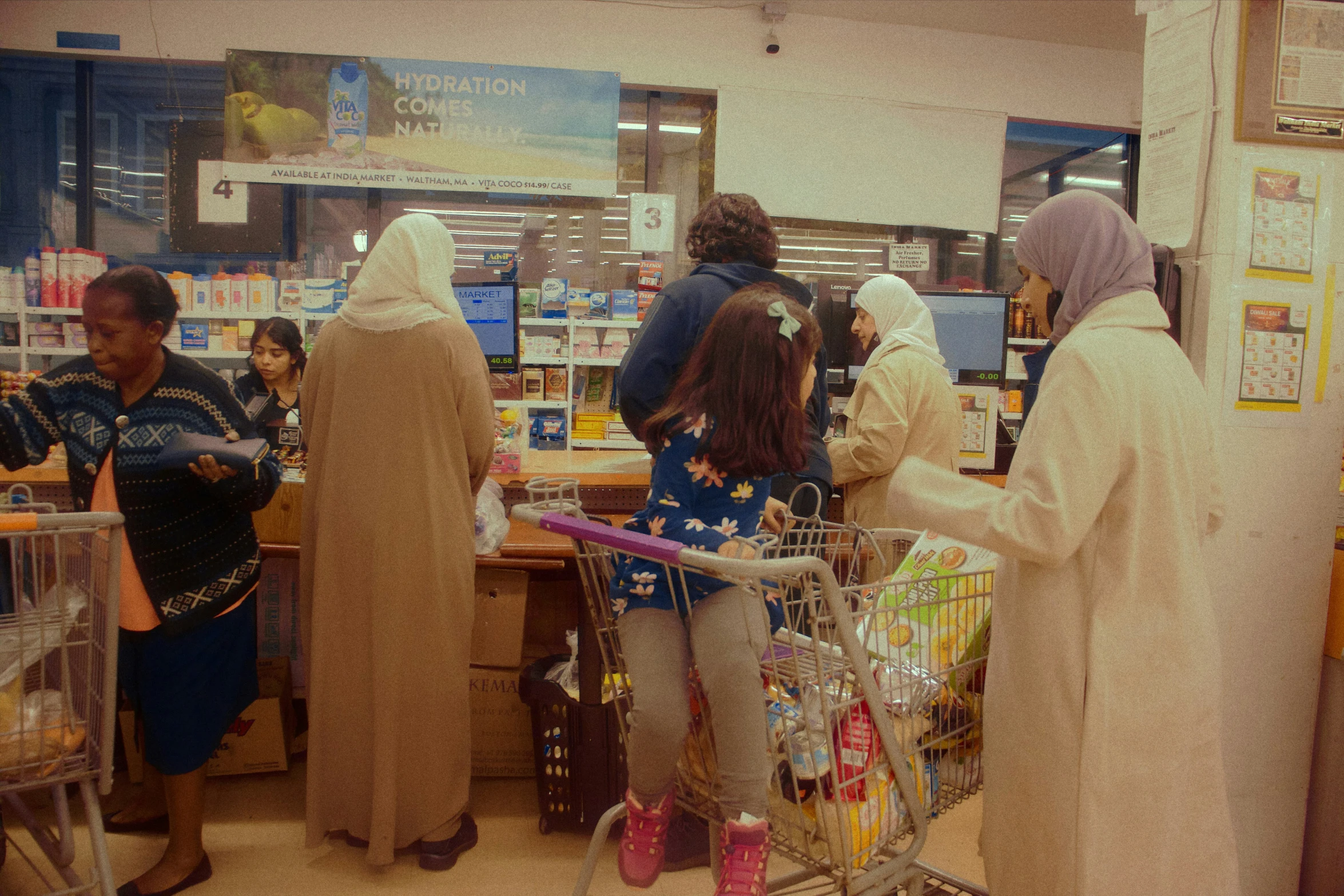 a group of women in a store with some items