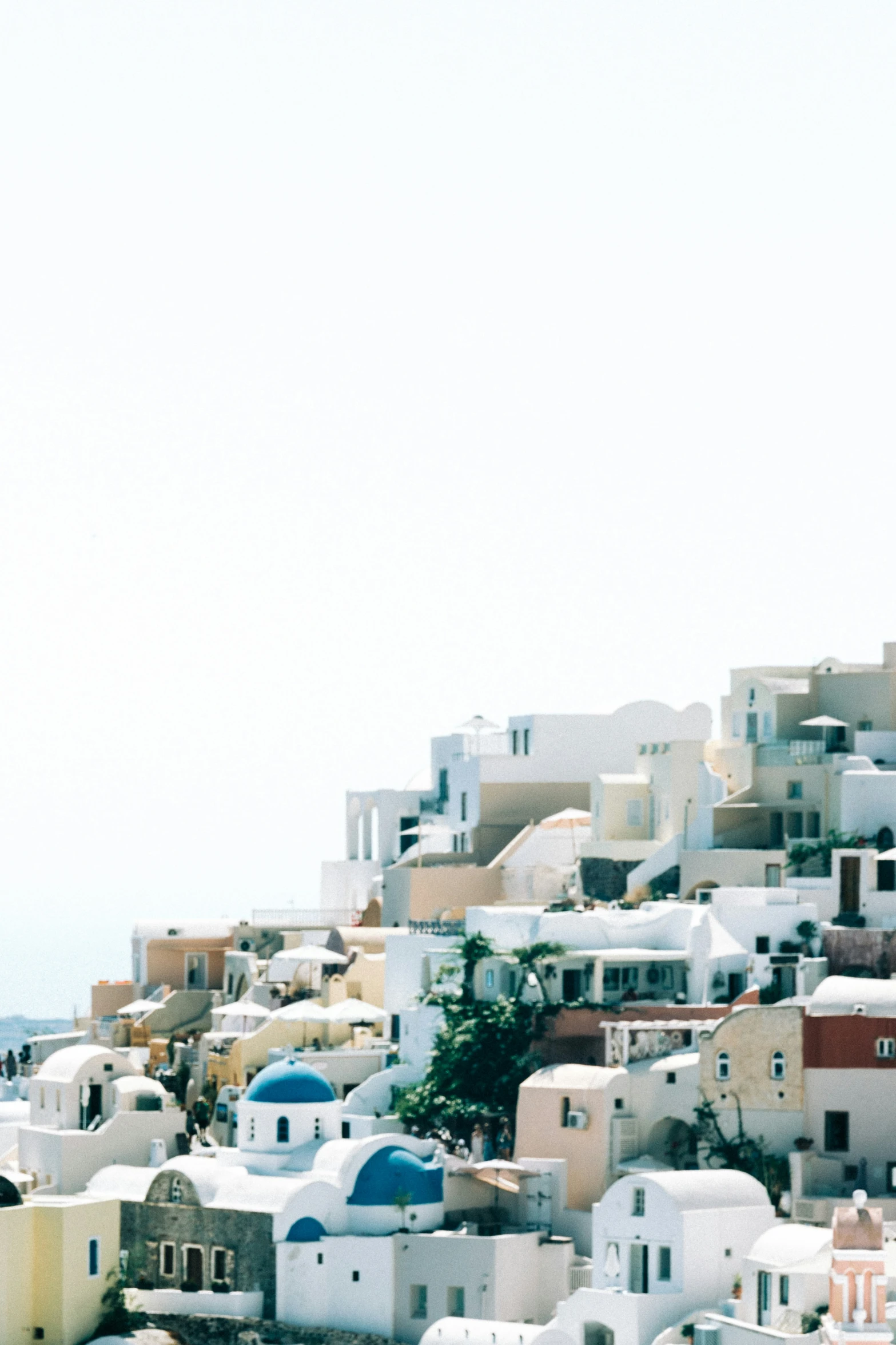 many different colored buildings on top of a mountain