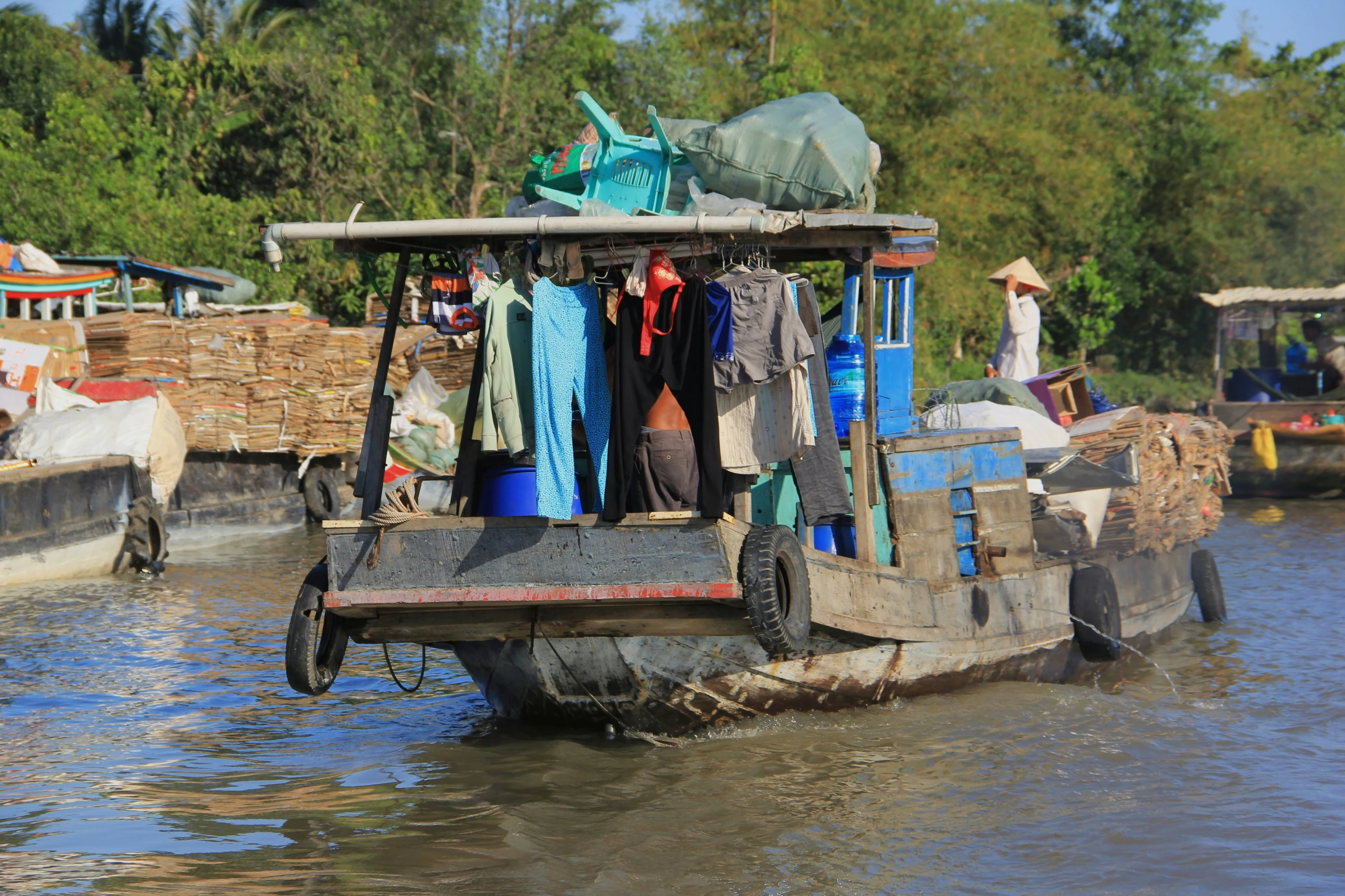 a house boat filled with a bunch of clothes