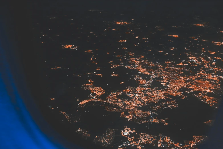 a city lit up at night from the air