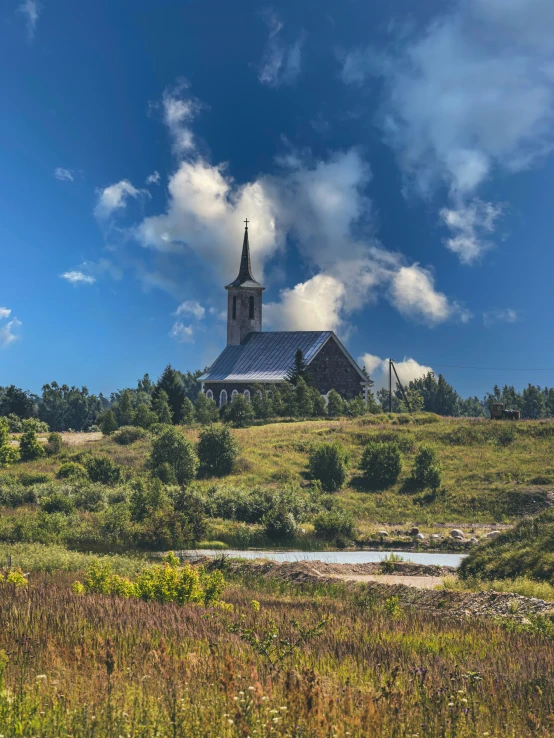 a beautiful church building on top of a hill