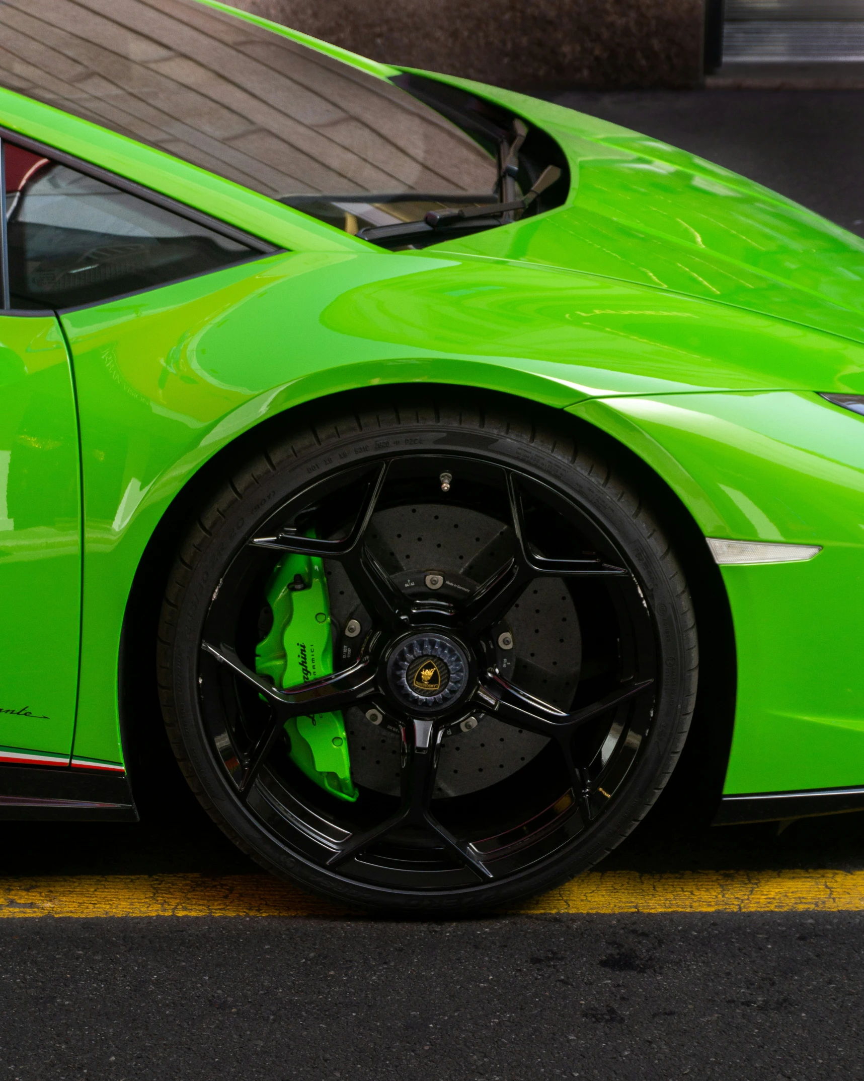 this car is lime green and has dark rims