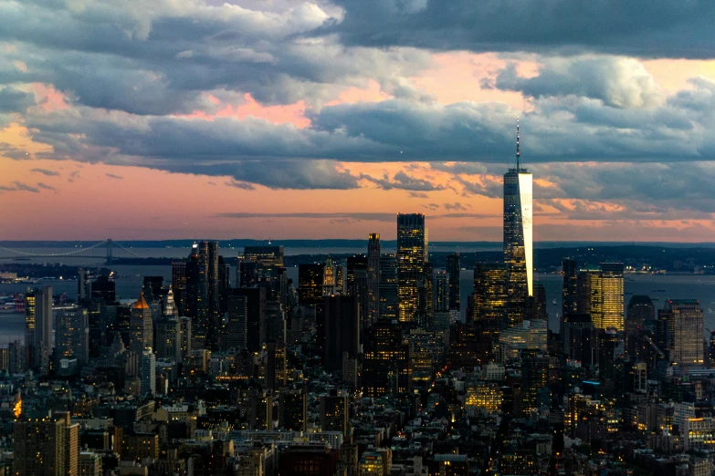 there are buildings and clouds over the city