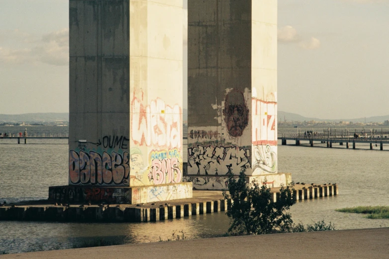 a view of some water from underneath the bridge