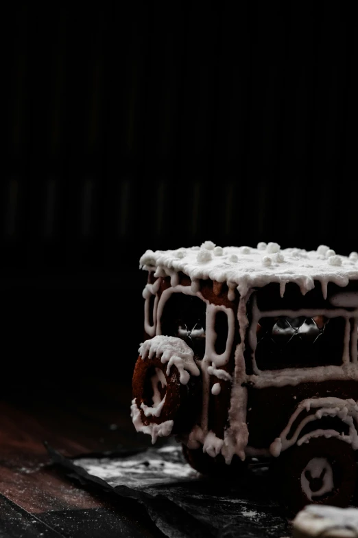 the frosted toy train is parked on the wooden table