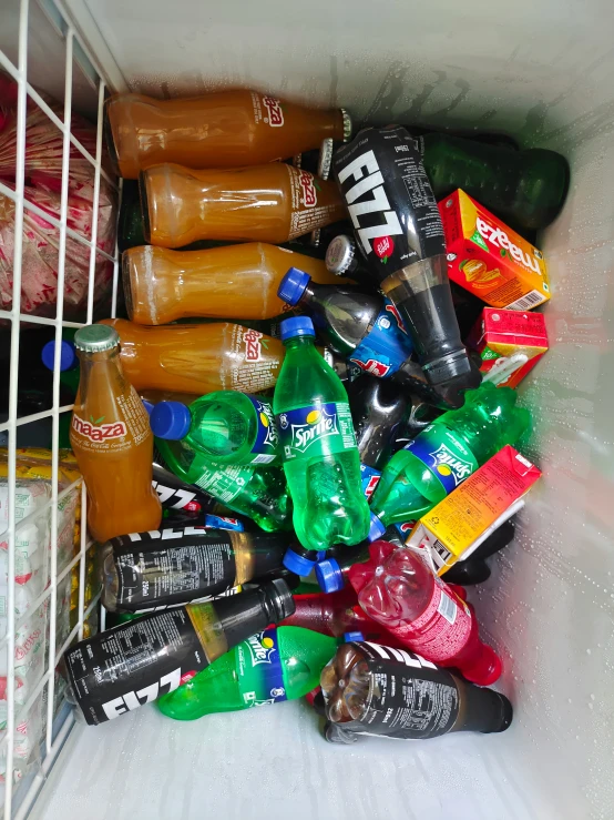 a pile of beer cans inside a cooler