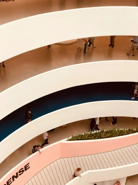 a group of people walking through a building