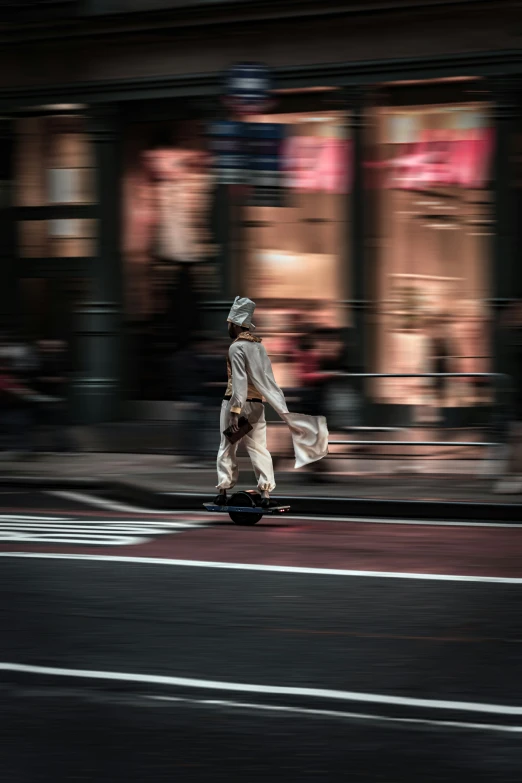 a person is riding on a skate board in the street