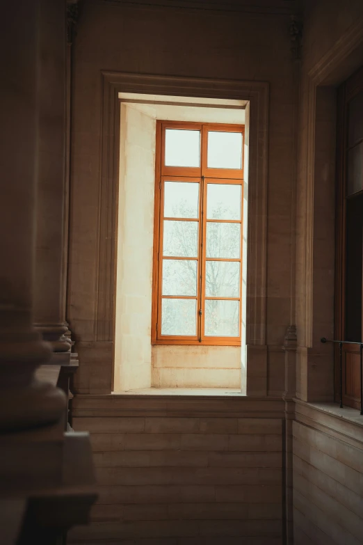 a window with an old wood frame at the center