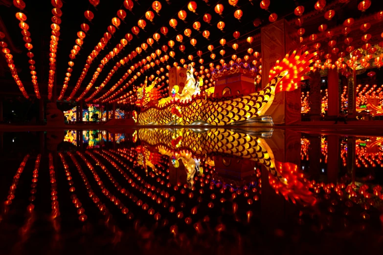 chinese lanterns are displayed on the inside of a building