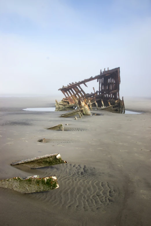 a beach with many rotting and broken objects