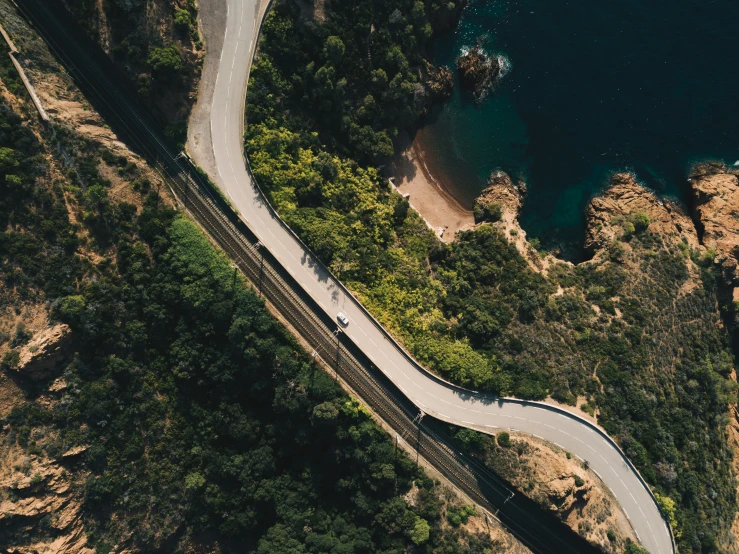 an aerial view of a road on a mountain side