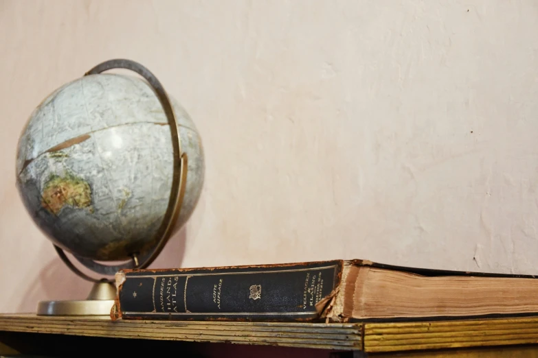 a stack of books with a light globe on top