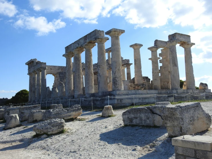 the ruins of the ancient city of paesta are displayed on white pebbles