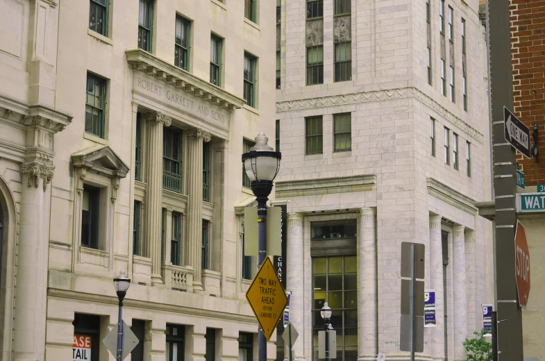 a sign in front of some white buildings