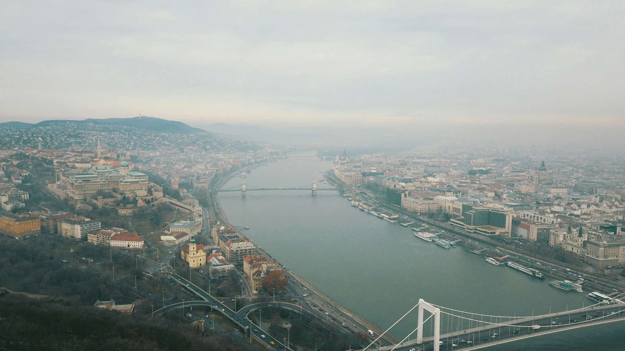 there is a view of an overcast city from a bridge