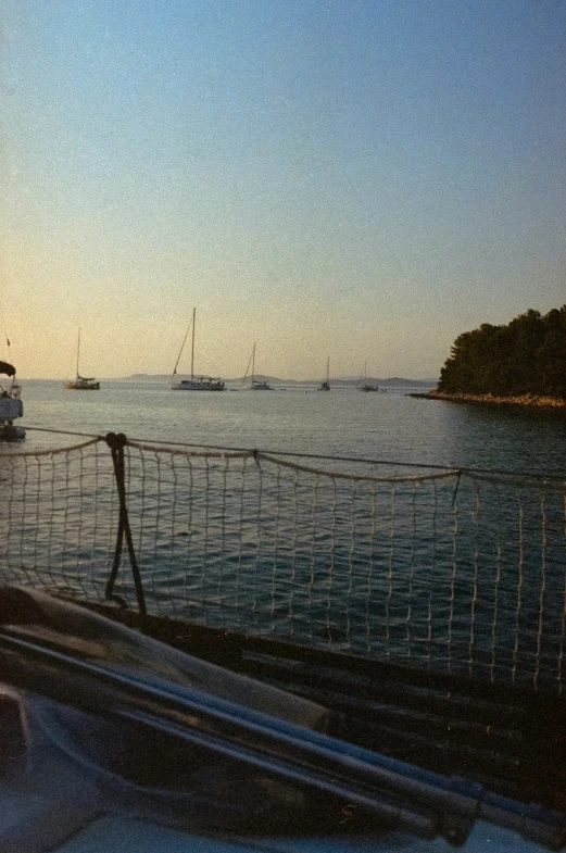 a boat on the water with some small boats in it