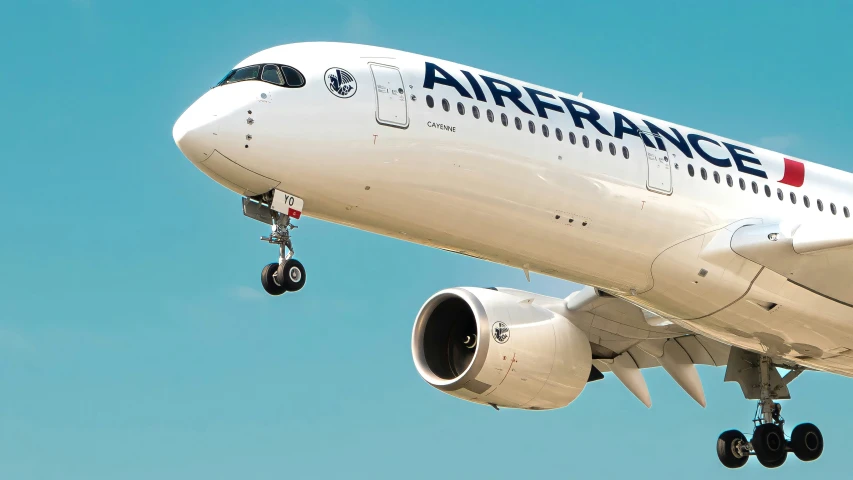 an airfrance plane flying against the sky