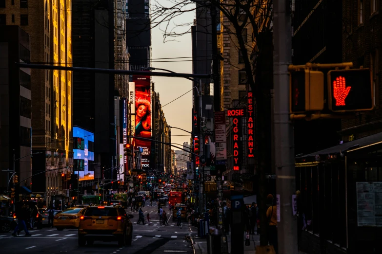 street view looking down new york city street at dusk