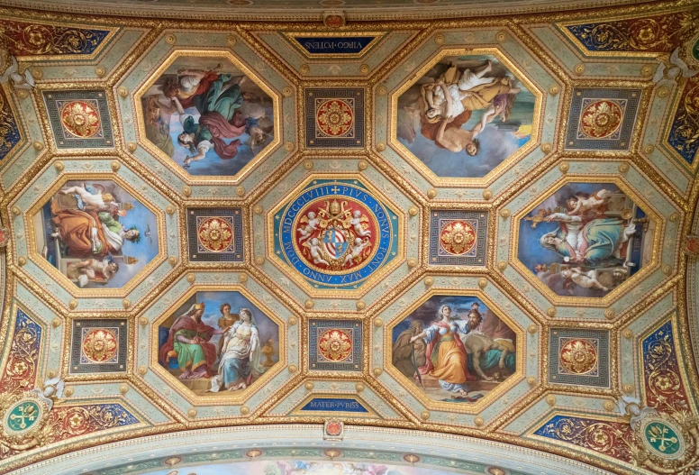 this is the ceiling of a building decorated with paintings and figures