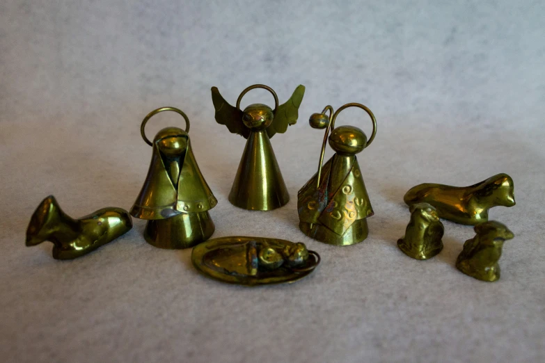 a collection of various golden angel figurines