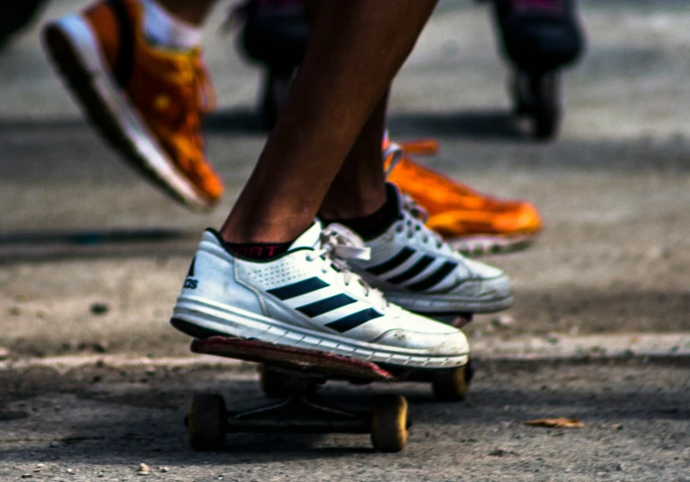 several persons on skateboards doing different moves