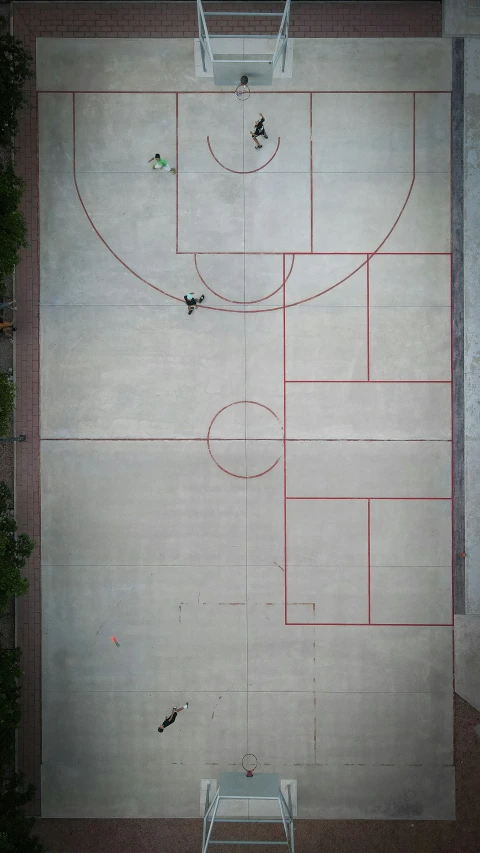 a basketball court with some people playing a game