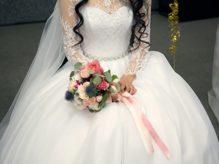 a woman is dressed up in a white wedding dress