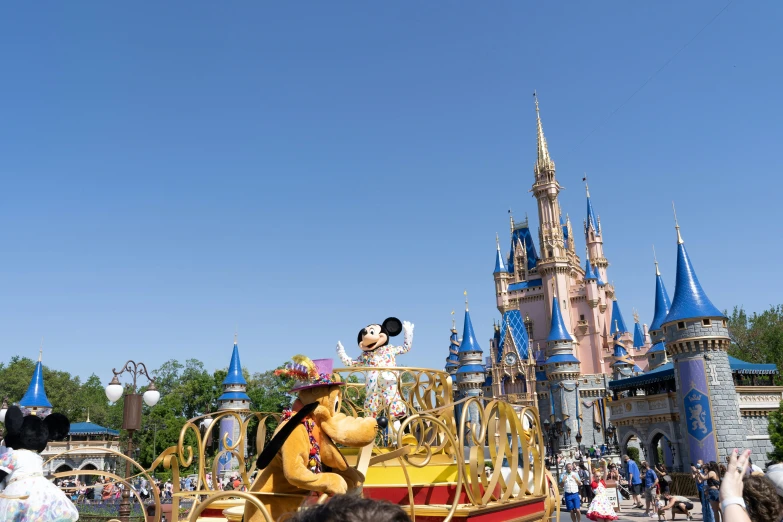 the goofy mouse float is paraded down the street