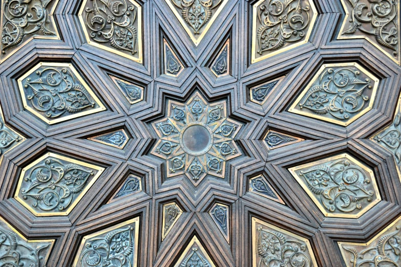 a large intricate wood piece with a circular motif