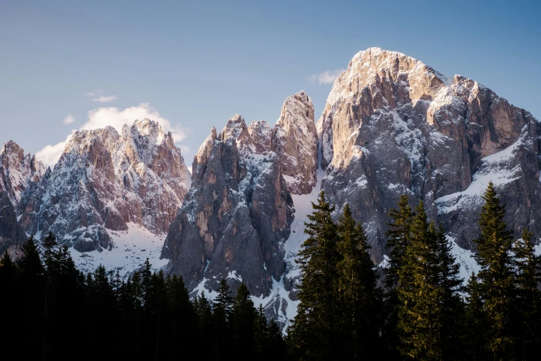 a mountain range in the middle of a forest