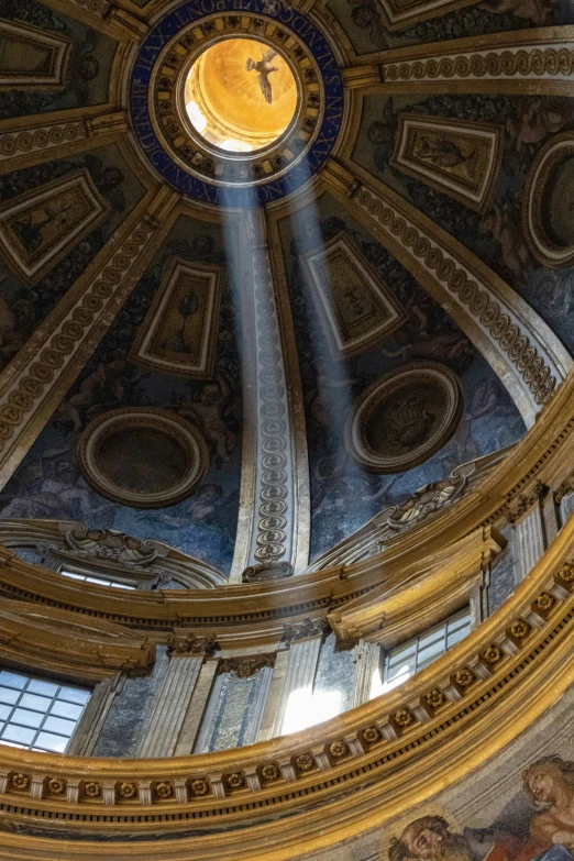 this large domed ceiling has a blue glass window