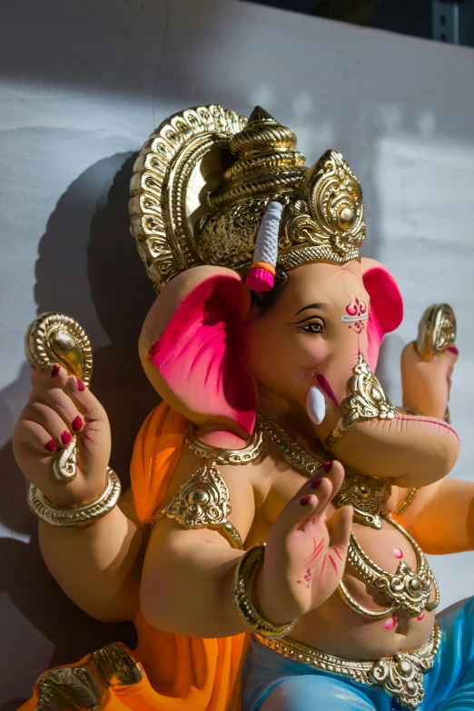 a statue of a ganesh and a nameplate