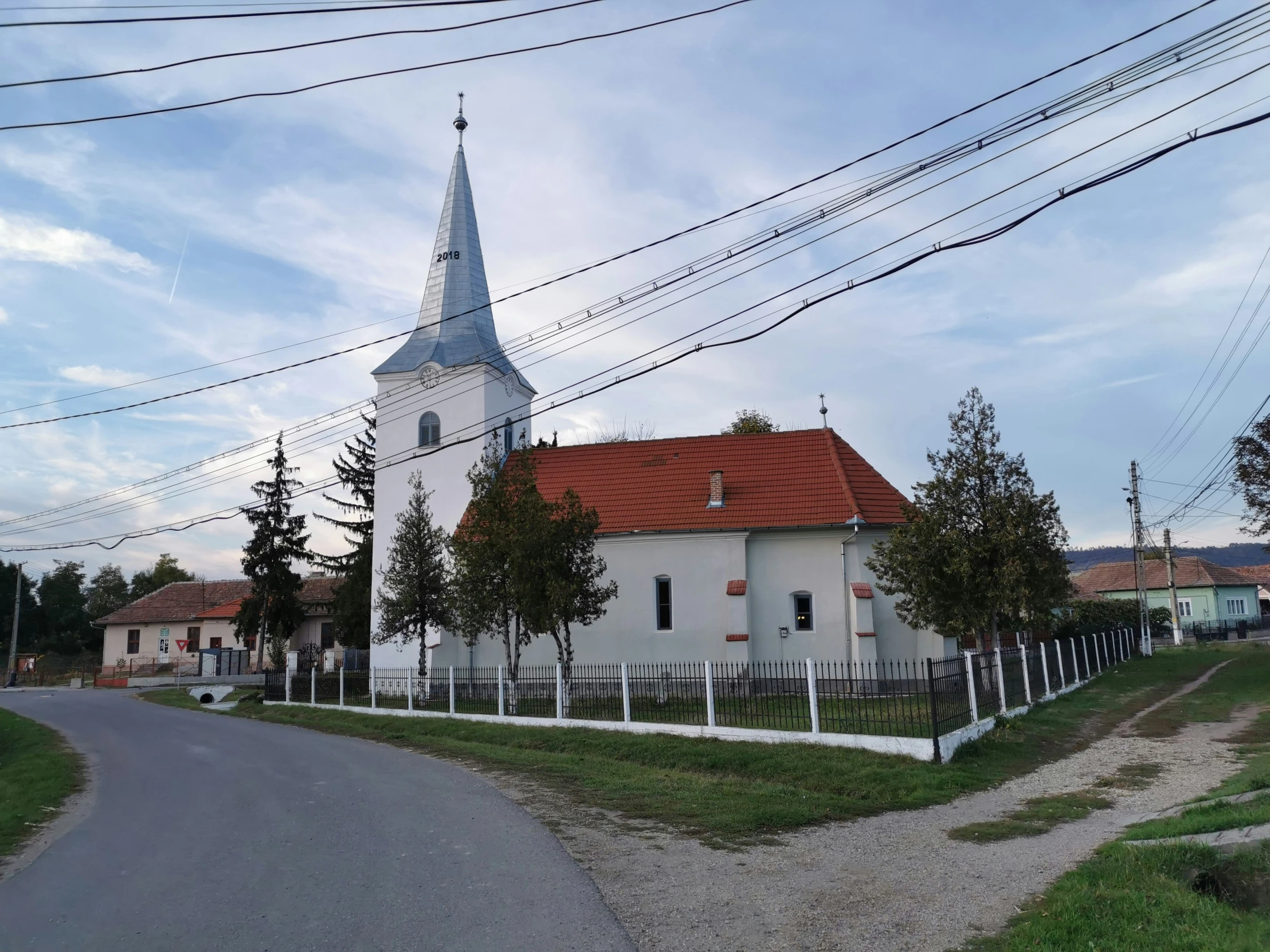 a small church on the side of a road