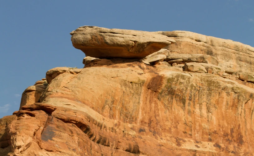rocks against a light blue sky in the desert
