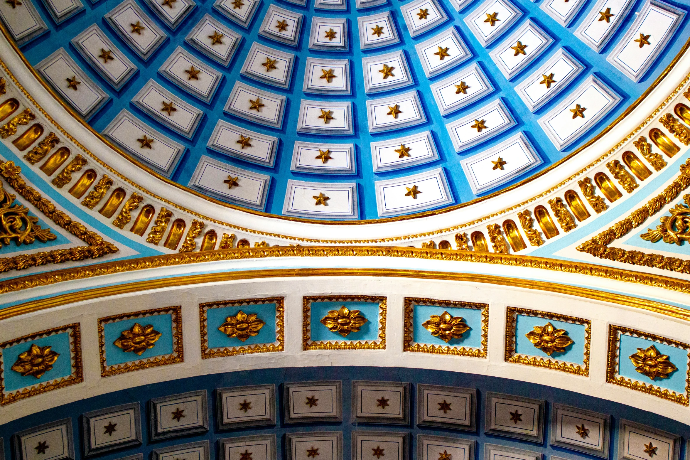 an ornate dome ceiling with gold and blue decorations