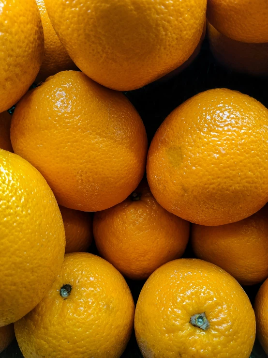 the fresh oranges are piled high and ready for consumption