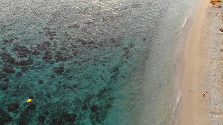 an aerial view of a shoreline in the ocean