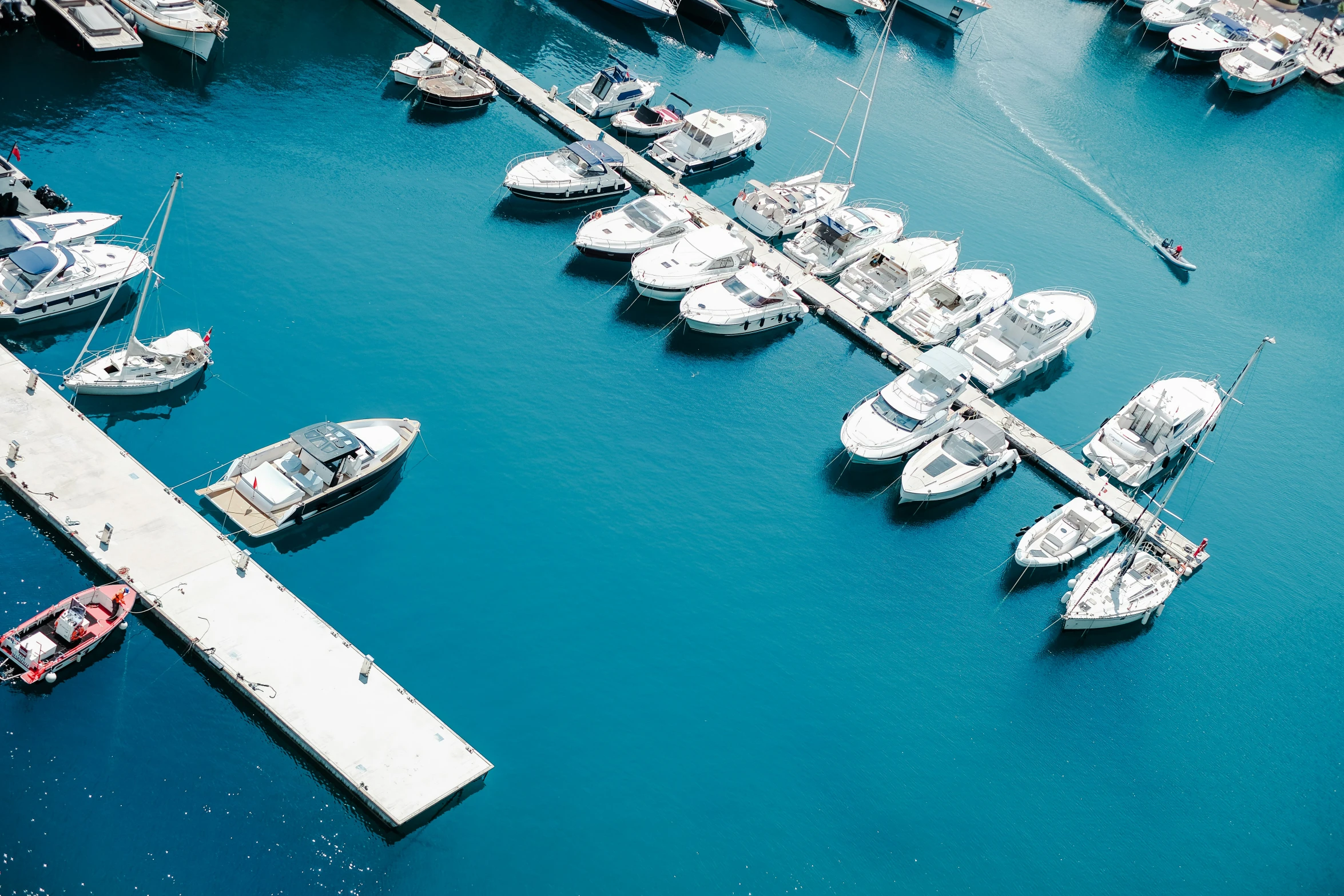 an aerial view of many boats in a harbor