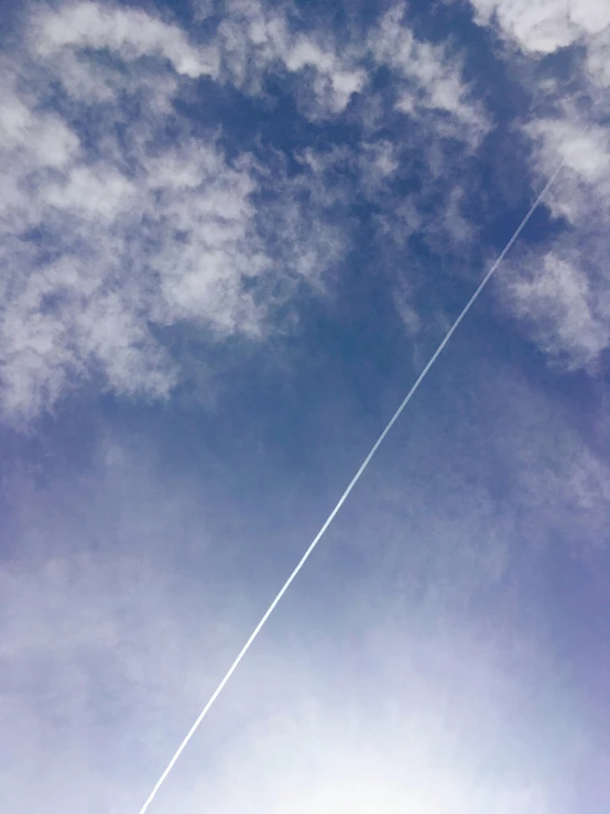 an airplane is shown flying high in the sky