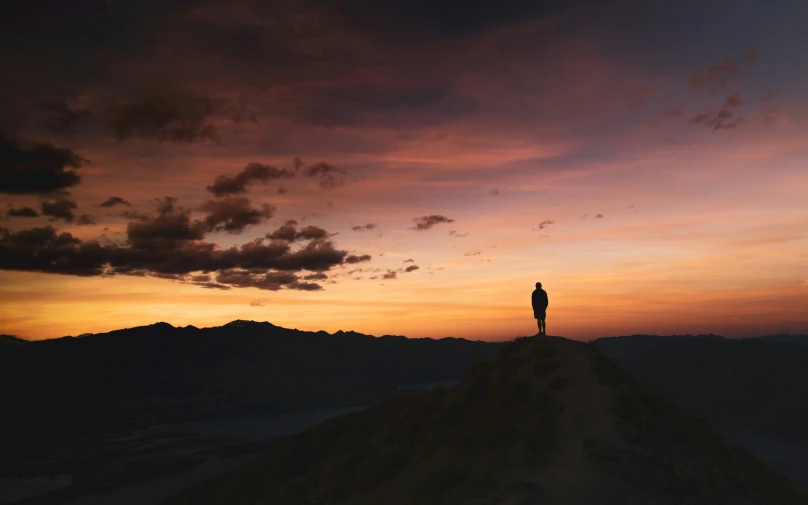 a person standing on top of a hill