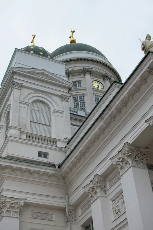 an elegant building that has a clock on it