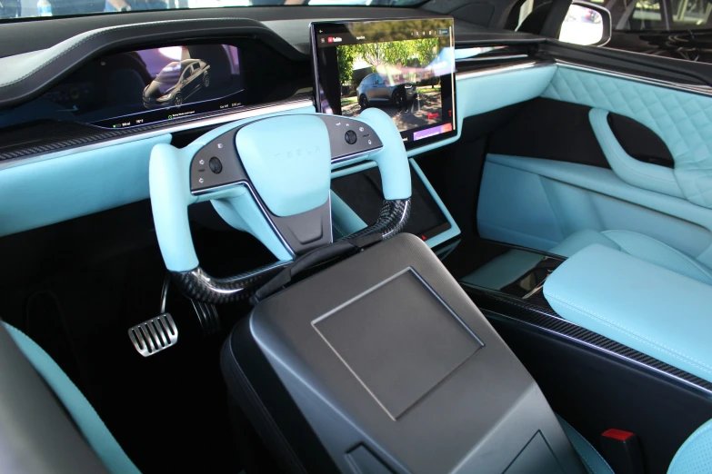 the dashboard of a car with a blue leather seat and matching center console