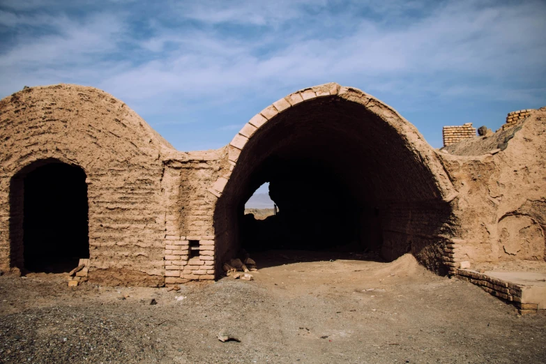 the remains of an ancient building, in a barren landscape