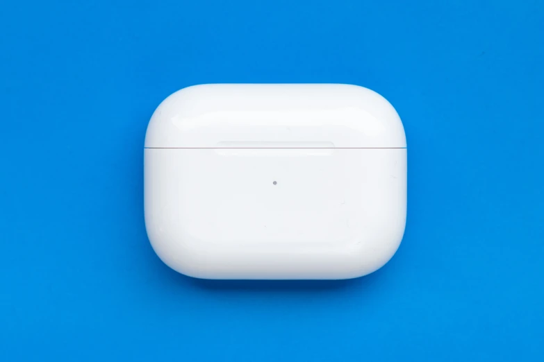 an airpods plug is on top of a blue background